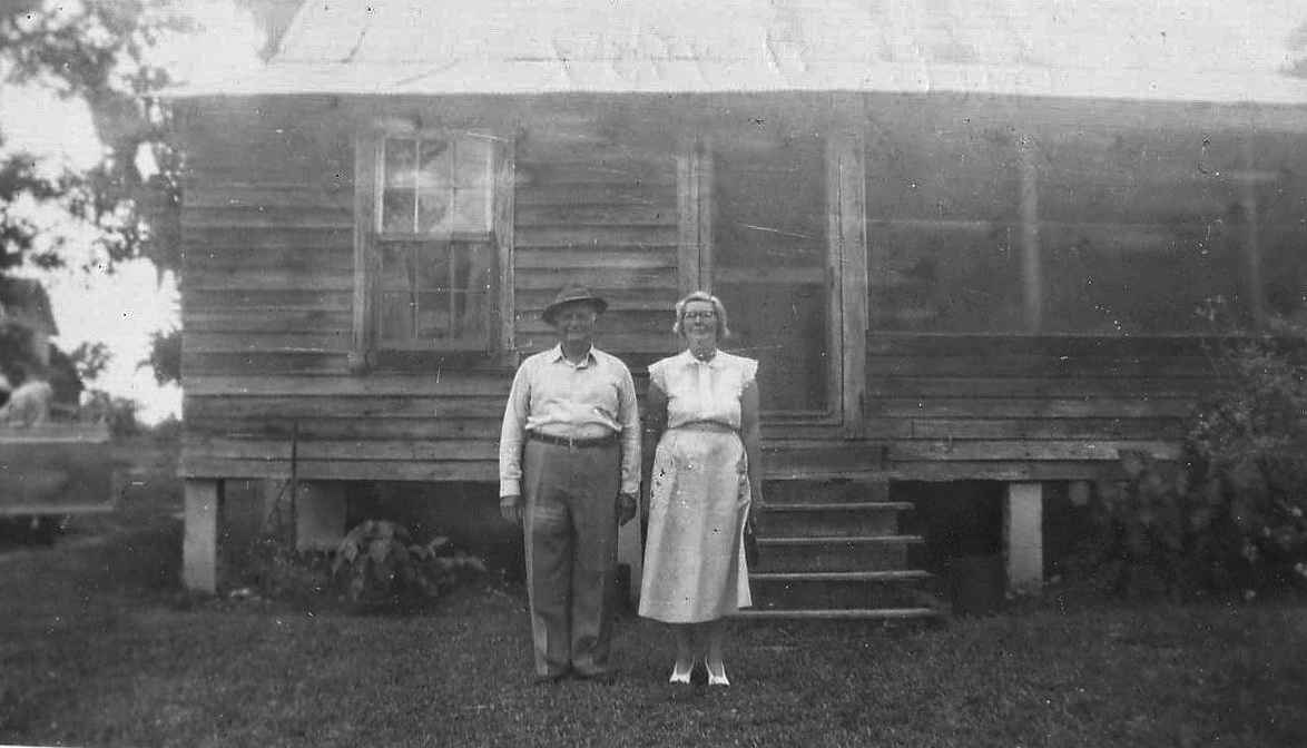Wilbur and Rosalie in front of the old house