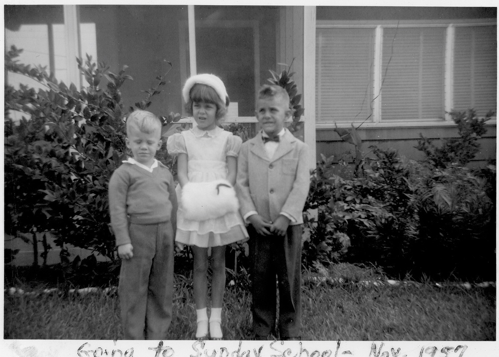 David, Brenda, Larry in front of the house