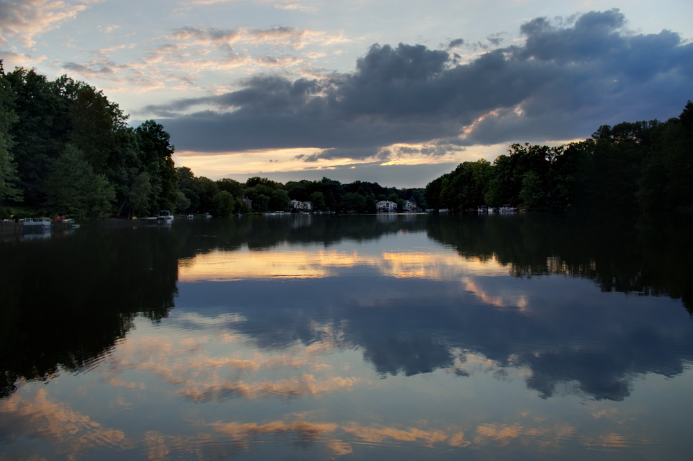 sunset colors reflect upon the lake