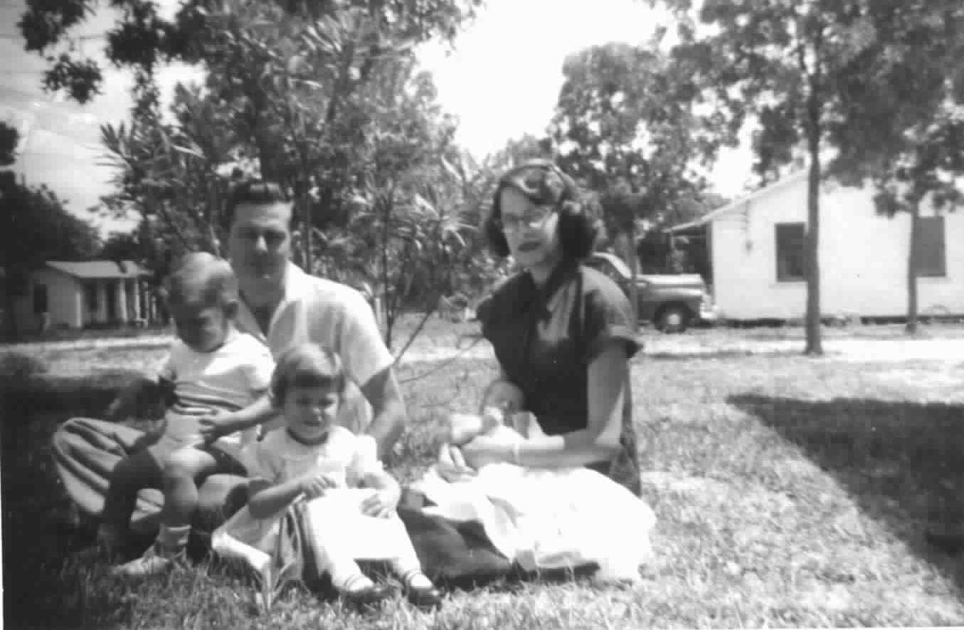 Dad holding me, Brenda, Mom with David