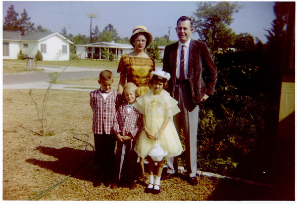 in the front yard, our driveway in background